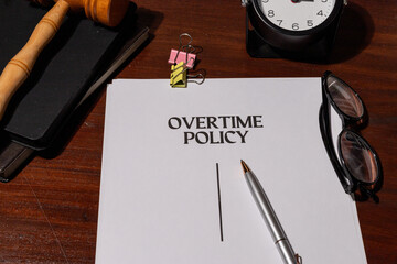 Overtime Policy Document on Table – Representation of Labor Regulations and Employment Standards