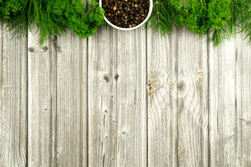 Fragrant fresh herbs for cooking on a wooden table. Background for writing a recipe