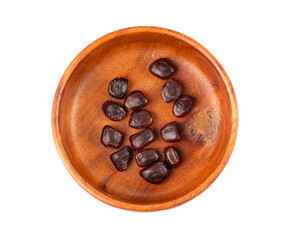 Dried tamarind seeds isolated, Tamarindus indica beans on a white background, medicine ingredient