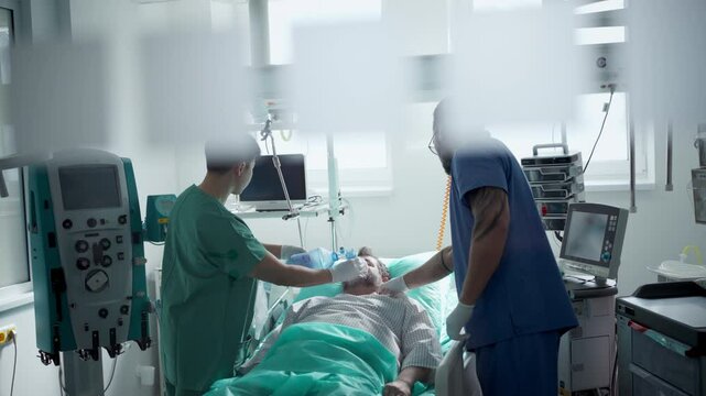 Medical team providing oxygen ventilation to unconscious patient in hospital.