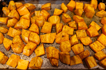 Fried Sweet Potatoes in a pan with seasoning 