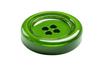 Shiny green button with four holes on black background, cut out
