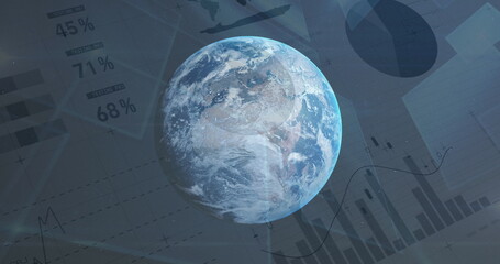 Spinning globe against statistical data processing in background