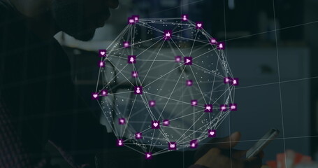 Globe of digital icons spinning against african american man using smartphone