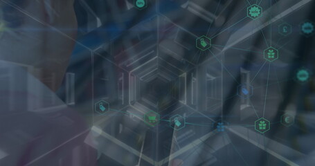 Network of digital icons and hexagonal tunnel against caucasian businesswoman using smartphone