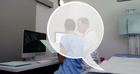 Image of speech bubble over diverse doctors using computer