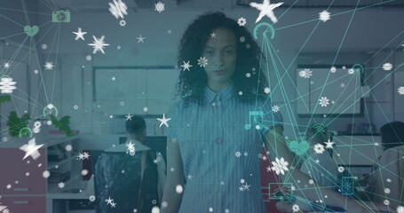 Image of connections and stars over woman standing in office