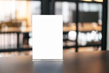 Blank menu frame on table in coffee shop stand for your text of display your product