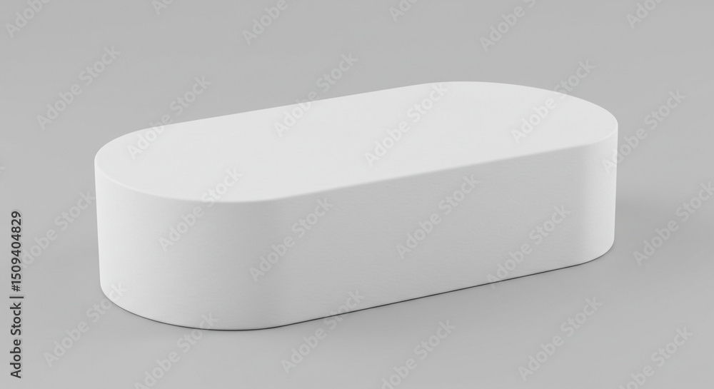 Poster a white rectangular prism with rounded edges sitting on a gray surface in a studio lighting setup