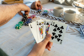 playing poker with a royal flush on the table