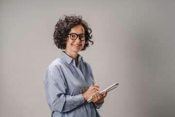 Portrait of smile businesswoman holding notebook, corporate concept