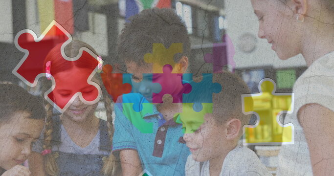 Image of colorful puzzle and heart over diverse children with tablets - Powered by Adobe
