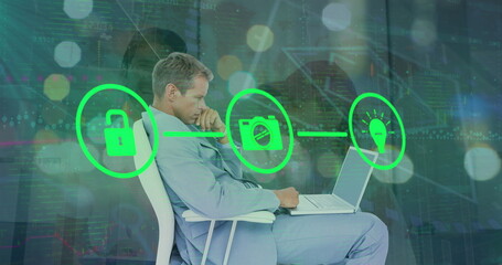 Image of network of connections with icons over caucasian businessman and diverse people