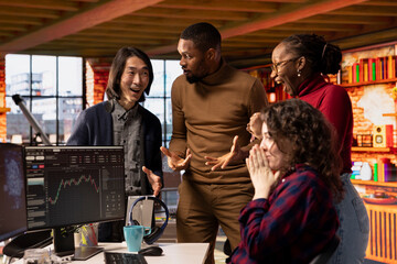 Happy startup team celebrating milestone after company goes public through IPO, obtaining capital....