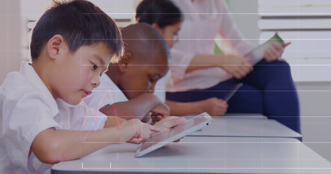 Image of data processing over diverse schoolchildren using tablets in classroom