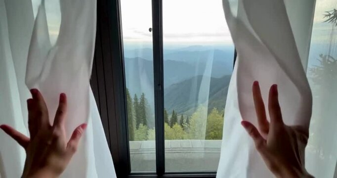 young woman looking through window