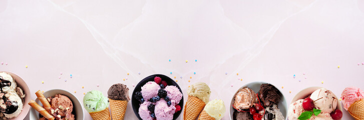 Summer ice cream bottom border. Bowls and cones of colorful assorted flavors. Top view on a soft pink stone banner background. Copy space.