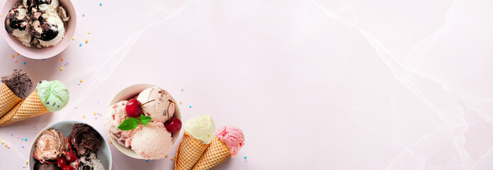 Summer ice cream corner border. Bowls and cones of colorful assorted flavors. Top view on a soft pink stone banner background. Copy space.