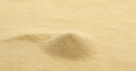 Yellow maca organic powder background and texture, side view	
