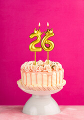 Number 26 birthday candle - Pink celebration cake with drip icing