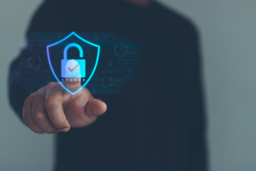 Businessman touching on virtual screen key lock for secure access, multi factor authentication, digital lock icon, cyber security interface. Showcases modern technology for access authentication.