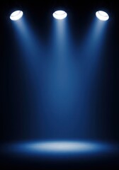 Three spotlights illuminating a stage in blue light