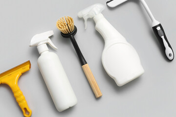 Set of cleaning supplies on color background