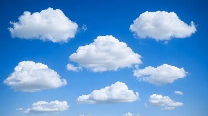 Obraz premium Fluffy White Clouds in a Vivid Blue Sky