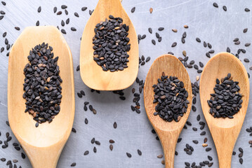 Black sesame seed in wooden spoon, Food ingredient, Top view