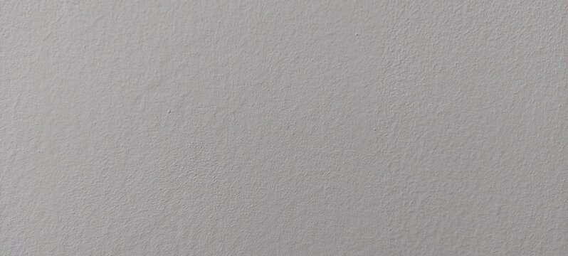 Textura gris clara de pared con acabado rugoso uniforme
