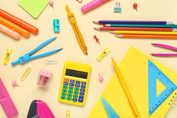 Composition with different school stationery on beige background