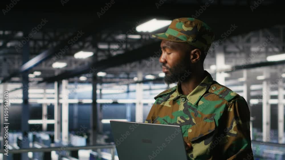 Poster army it specialist in data center using laptop to defend networks against cyber threats. military co