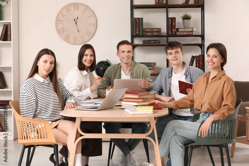 Poster group of students studying at table in library