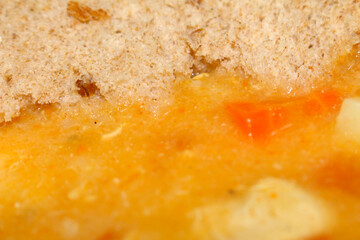 Chicken Soup with Carrots and Bread. Homemade Comfort: Hearty Chicken Soup with Fresh Vegetables....
