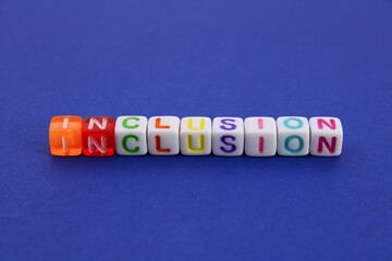 Letter cubes that form the word INCLUSION