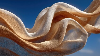 Elegant flowing fabric against vibrant blue sky background creates airy ambiance