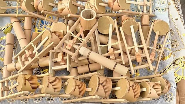 Otok-otok, Indonesian traditional toys made of bamboo and wood. The way to ring it is by turning it, the faster it is, the louder the sound will be
