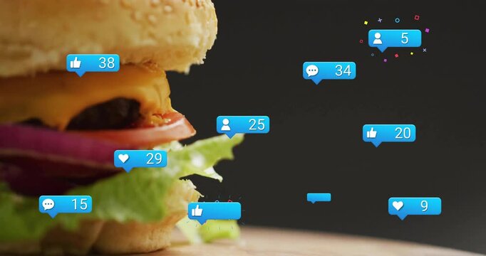 Social bubbles rising around sesame seed cheeseburger on board triggered by engagement rise
