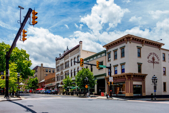 Bethlehem, PA - US - May 25, 2025 Charming downtown Bethlehem, features historic architecture, outdoor cafes, and boutique shops along Broad and Main Streets under a bright sky with scattered clouds.