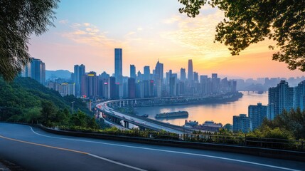 Obraz premium A scenic view of a cityscape at dawn with road foreground