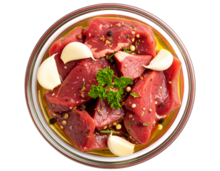 Raw marinated meat slices with herbs, slices, olives oil and garlic isolated on white background. Suitable for marketing or business purposes. PNG file