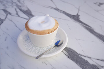 Delicious cappuccino served in a cozy cafe setting