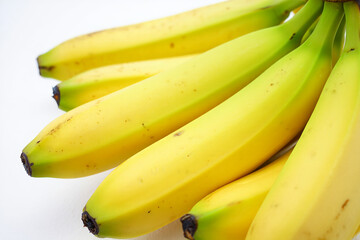 Bunch of ripe yellow bananas isolated on white background