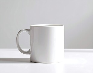 Obraz premium Blank white mug on a white surface
