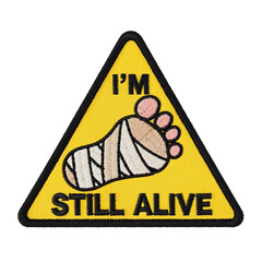 Yellow triangular patch showing bandaged foot and saying i'm still alive, santiago de compostela on transparent background