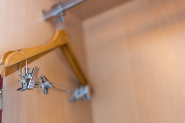 Wood clothes hanger in a wardrobe a simple wardrobe. Close up