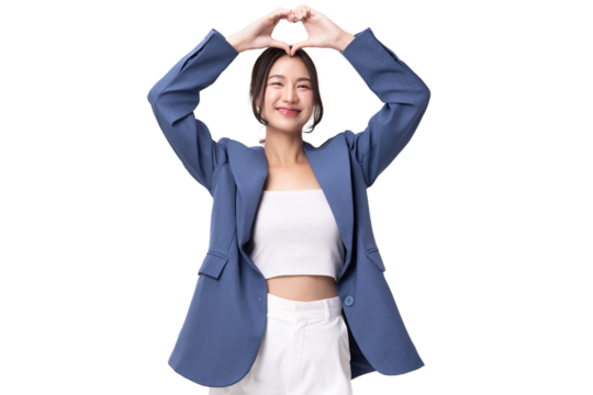 Portrait of happy young business woman showing heart shape hand sign isolated on transparent background, PNG file format.