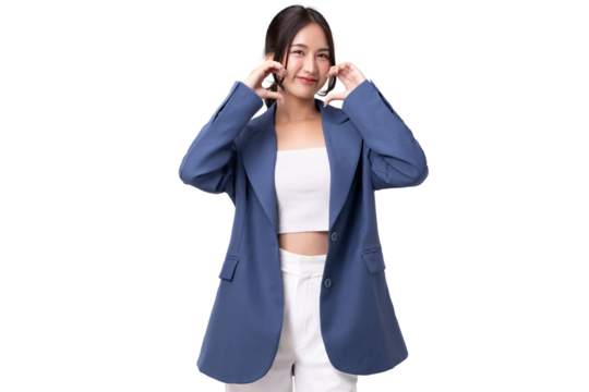 Portrait of happy young business woman showing heart shape hand sign isolated on transparent background, PNG file format.