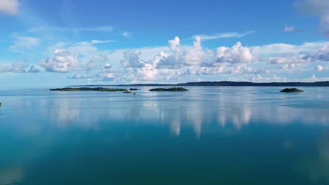 Maratua, Indonesia: Aerial drone footage of island inside the Maratua turquoise lagoon in the Derawan archipelago in Kalimantan in Indonesian Borneo. 