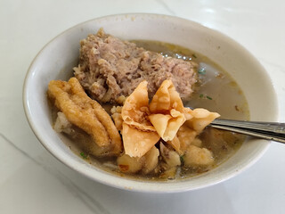 Bakso, Meatballs are served in white bowls, equipped with various toppings, they look delicious and delicious, at roadside stalls.